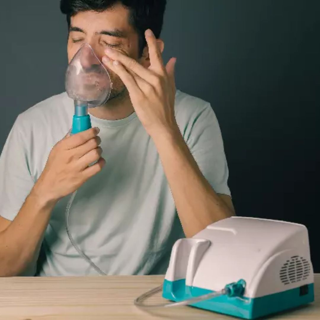 Types of Nebulisers banner image showing a man using a nebuliser Types of Nebulisers banner image showing a man using a nebuliser